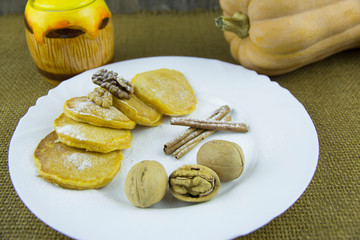 Pumpkin pancakes with walnuts and honey sauce