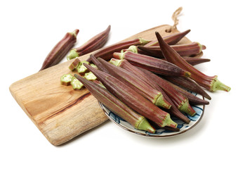 Red okra on white background