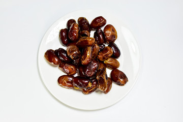 Date palm in the white plate on a white background.In palm.