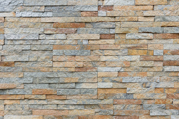 Natural facade stone decoration quartzite background texture. modern granite stone wall