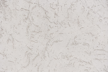 Rough white relief stucco wall texture background. blank for designers