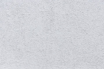 Rough white relief stucco wall texture background. blank for designers