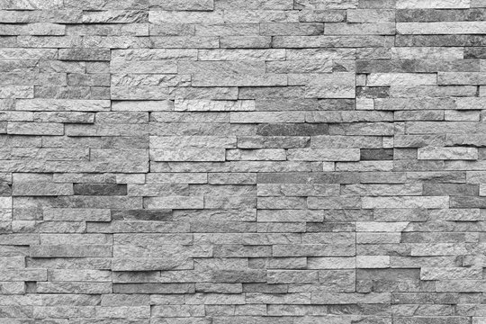 White natural facade stone decoration quartzite background texture. modern granite stone wall.