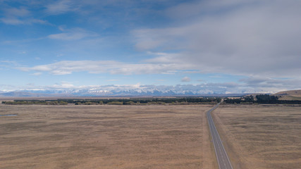 Aerial view of long inland scenic route with snowcap mountain in South Island,New Zealand.