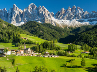 Italy, september 2017: St. Magdalena with its characteristic church in front of the Geisler Dolomites mountain peaks in the Villnosstal in autumn.