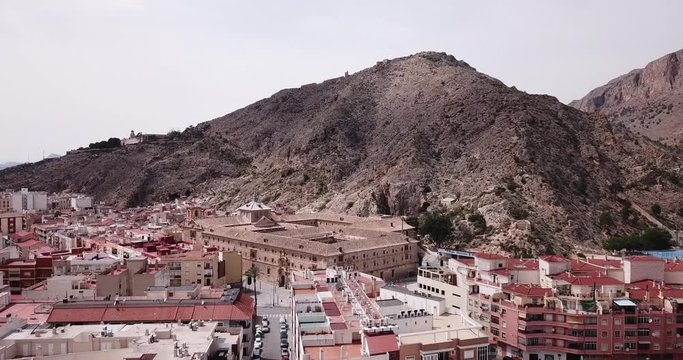ORIHUELA, SPAIN - APRIL 17, 2019: High view of Orihuela in Alicante with old University, mountains and buildings