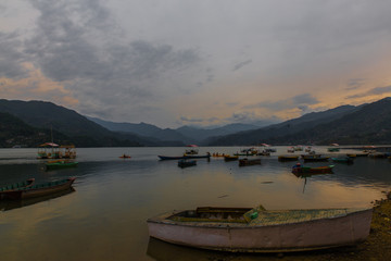 colorful boats in Fewa lake after the storm in Pokhara, Nepal
