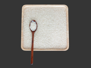 isolated jasmine rice on wooden tray