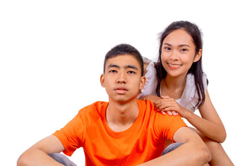 Young boy and girl friends sit together