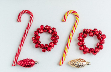 2020 of Christmas candies and toys. Minimal creative new year concept.