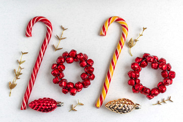 2020 of Christmas candies and toys. Minimal creative new year concept.
