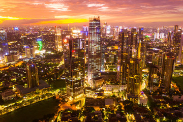 Beautiful glowing skyscrapers at dramatic sunset