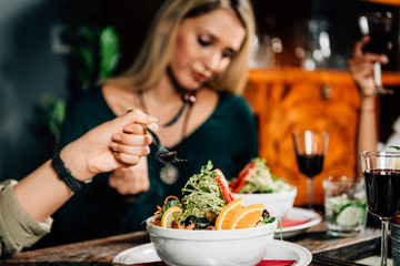 Vegetarian Restaurant. Young Woman In A Vegetarian Restaurant