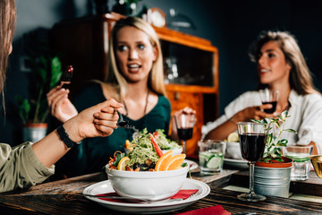 Vegetarian Restaurant. Female Friends In A Vegetarian Restaurant