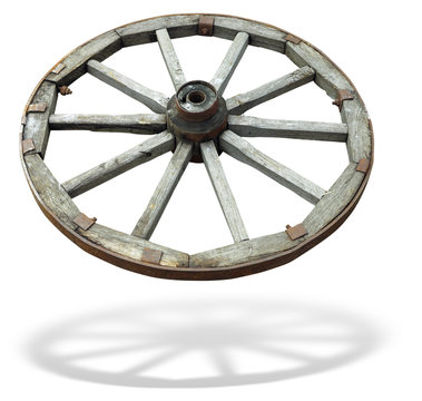 Old brown wooden wagon wheel from a cart isolated over white