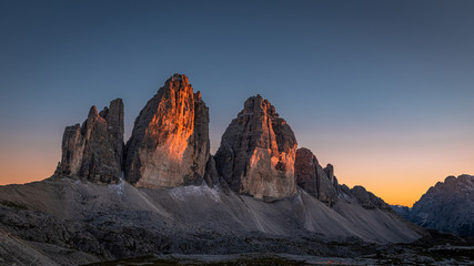 Naklejka premium Beautiful view to Tre Cime peaks at sunset, Dolomites, Italy