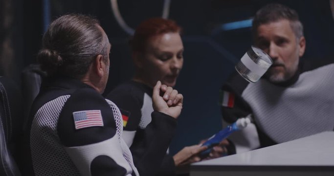Astronaut catching tin can in zero gravity