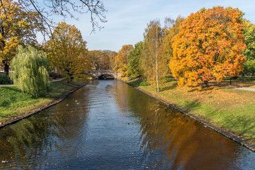 River Running through the Center of a City in Northern Europe in Autumn