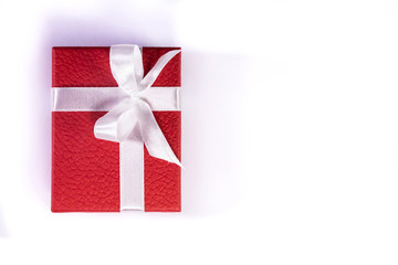 One single Red gift box with ribbon isolated on white background with copy space