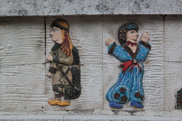 old ottoman puppets on the wall as relief. Bursa, Turkey