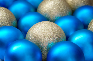 Christmas and New Year background. blue and gold sparkling balls