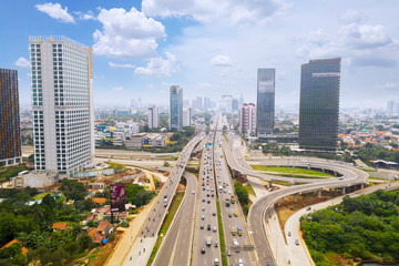 Fototapeta na wymiar Highway traffic with cars and busy roads in Jakarta