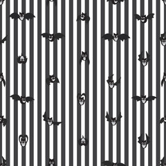 Seamless cartoon bat vector pattern on striped background.