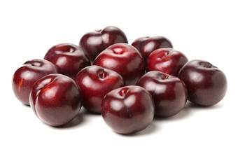 Plums on white background