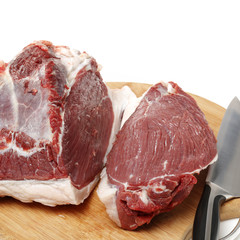 raw beef in wooden board isolated on white background