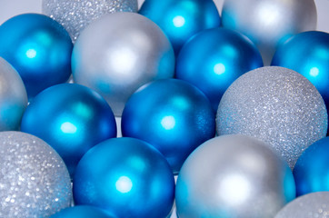 Christmas and New Year background. blue and silver sparkling balls