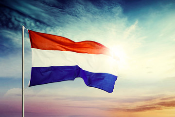 Netherlands national flag waving at sunrise time