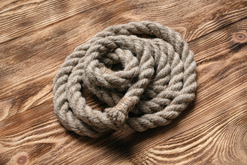 Rope on brown wooden floor background with copy space.