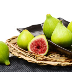 Ripe figs on a white background
