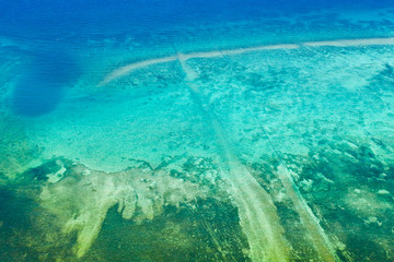 Background image of the turquoise sea. Deep sea and corals. Different depths in the sea.