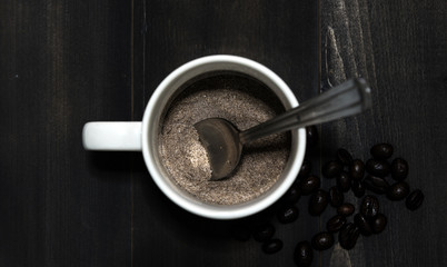 Instant coffee in cup on wooden background