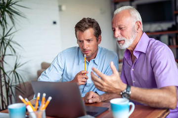Two businessmen working together