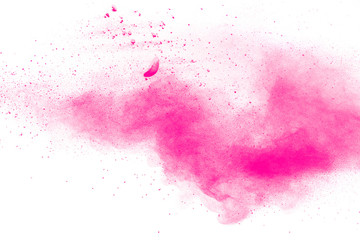 Abstract pink dust explosion on white background.  Freeze motion of pink powder splash.