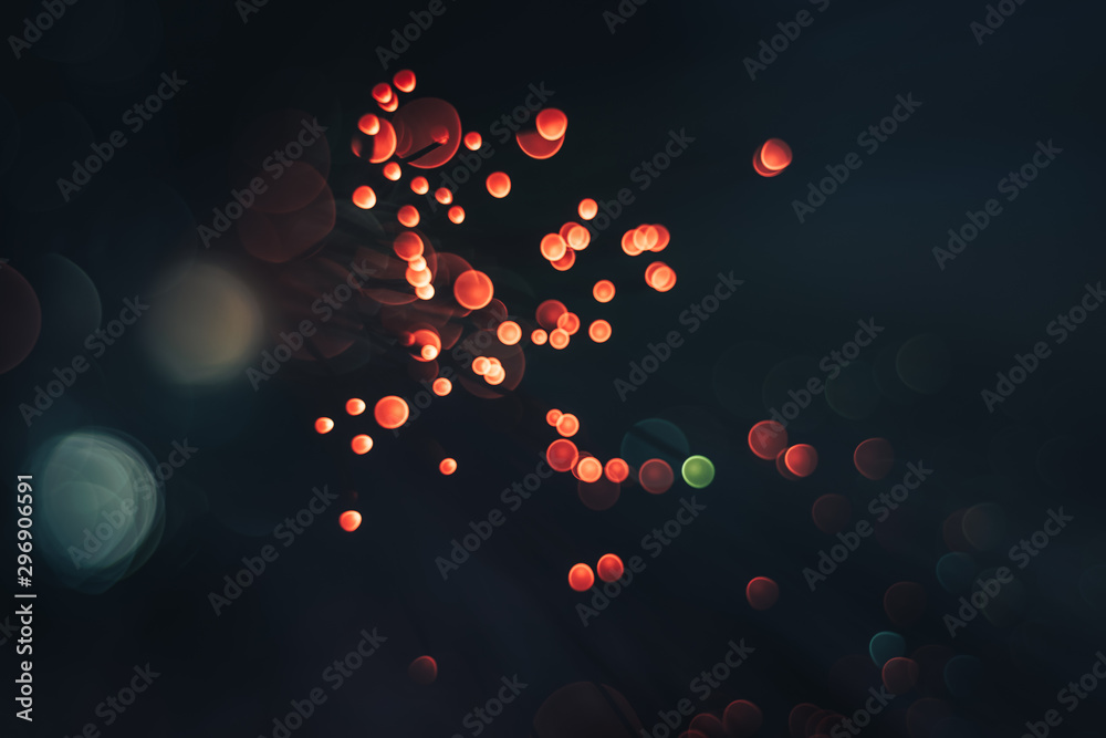 Poster beautiful red abstract optical light bokeh in the darkness background.