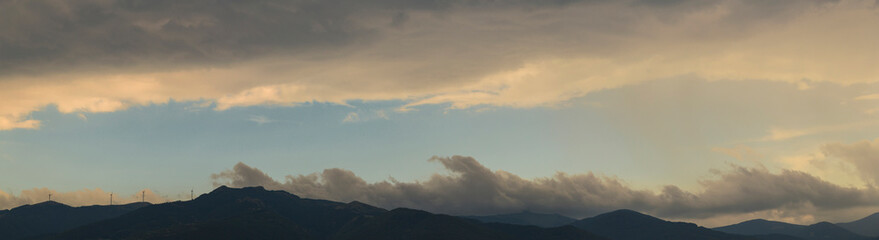 Thunderhead covers the Balkans. Downpour is approaching agricultural land. Villages, fields and...