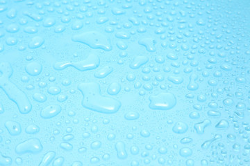 Close up water drops on blue background, Water drop in macro photography