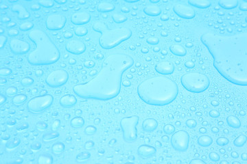 Close up water drops on blue background, Water drop in macro photography