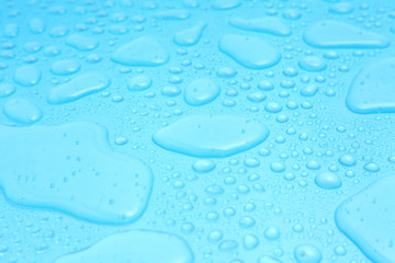 Close up water drops on blue background, Water drop in macro photography
