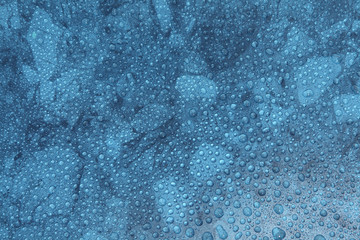 Obraz premium Close up water drops on blue background, Water drop in macro photography
