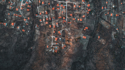 Overhead Aerial Shot of settlement in rural area .Shot From air.