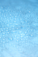 Close up water drops on blue background, Water drop in macro photography