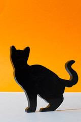 halloween black cat silhouette on orange background