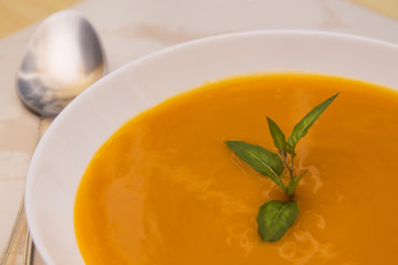 Pumpkin soup close up view, diet concept