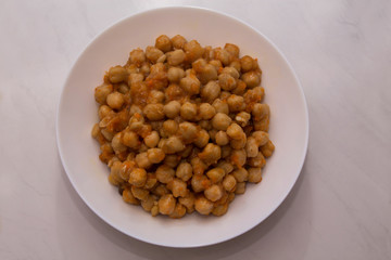 Cooking chickpeas bowl stone background top view