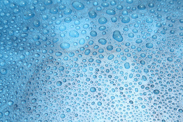 Close up water drops on blue background, Water drop in macro photography