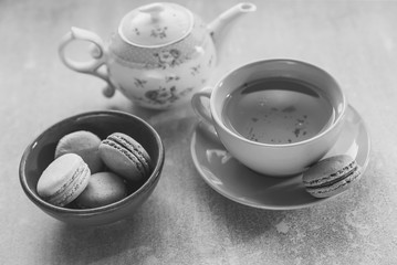 pink macaroons with teapot and Cup